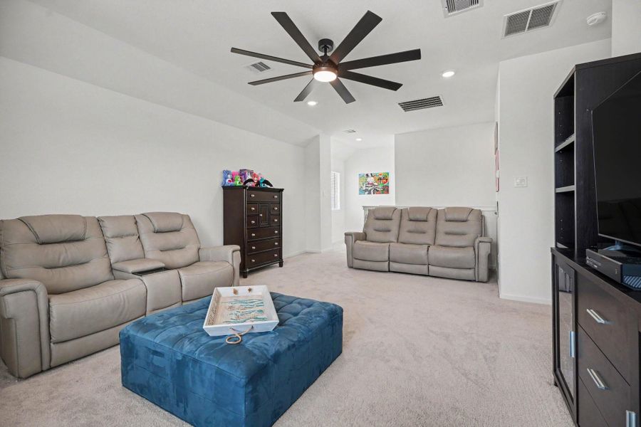 Spacious upstairs game room with vaulted ceilings, recessed lighting, and plenty of room for media, recreation, or gathering space. Spacious upstairs game room with vaulted ceilings, recessed lighting, and plenty of room for media, recreation, or gathering space.