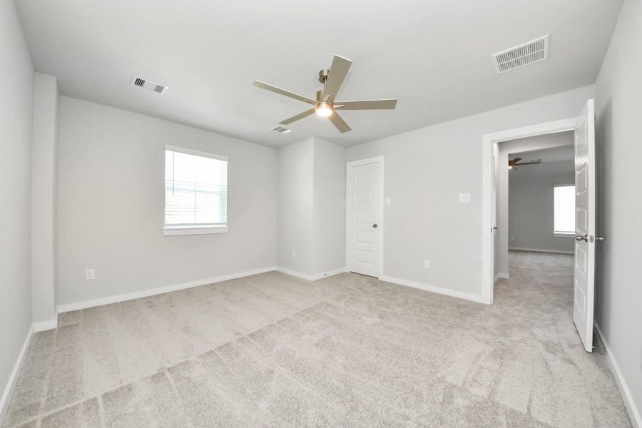 Generously sized secondary bedrooms featuring spacious closets, soft and inviting carpeting underfoot, large windows allowing plenty of natural light, and the added touch of privacy blinds for your personal retreat. Sample photo of completed home with similar floor plan. Actual colors and selections may vary. Generously sized secondary bedrooms featuring spacious closets, soft and inviting carpeting underfoot, large windows allowing plenty of natural light, and the added touch of privacy blinds for your personal retreat. Sample photo of completed home with similar floor plan. Actual colors and selections may vary.