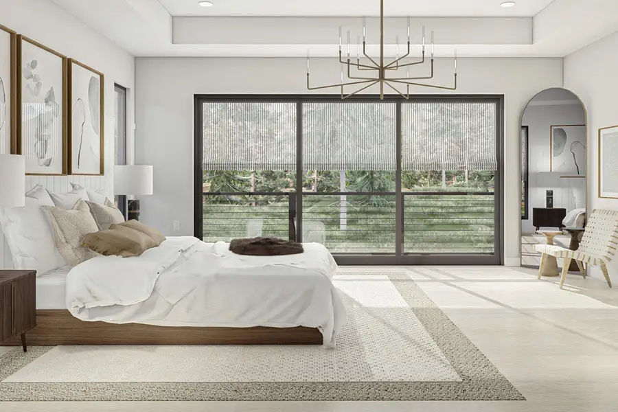 Bedroom featuring a raised ceiling, arched walkways, a chandelier, and recessed lighting