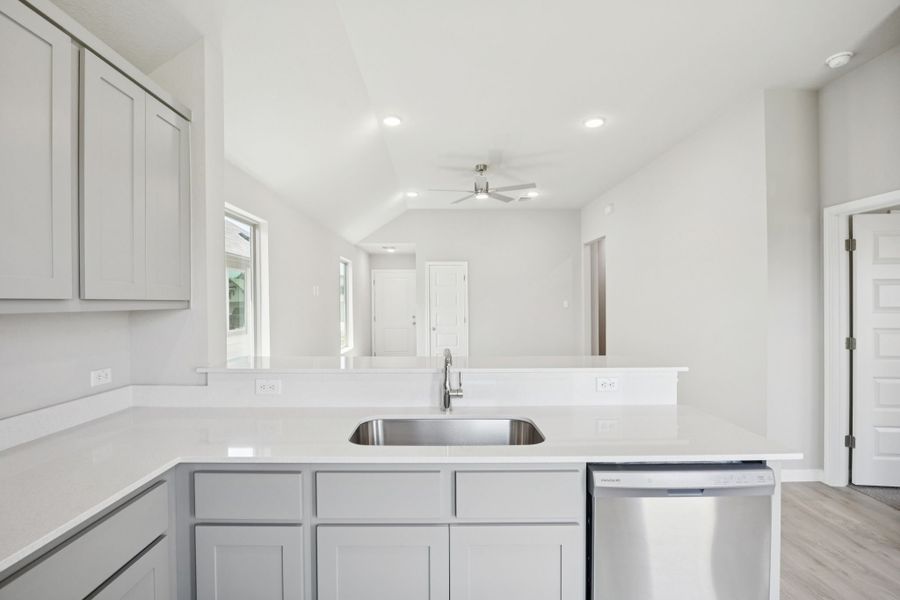 Kitchen in the Pine home plan by Trophy Signature Homes - REPRESENTATIVE PHOTO