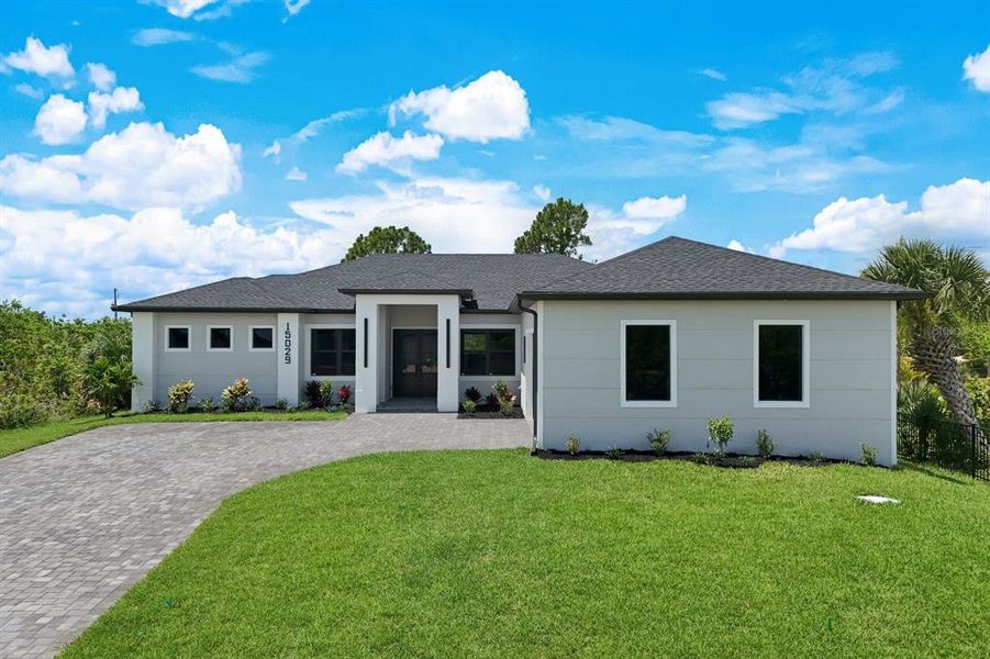 Front exterior of a new home in , Port Charlotte, FL, highlighting curb appeal (Image 2). Front exterior of a new home in , Port Charlotte, FL, highlighting curb appeal (Image 2).