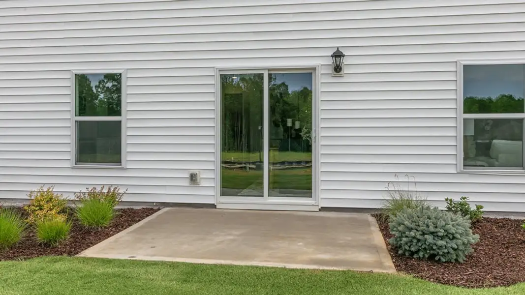 Exterior details and patio area of a home in Lawson Glen, Clayton (Image 3). Exterior details and patio area of a home in Lawson Glen, Clayton (Image 3).
