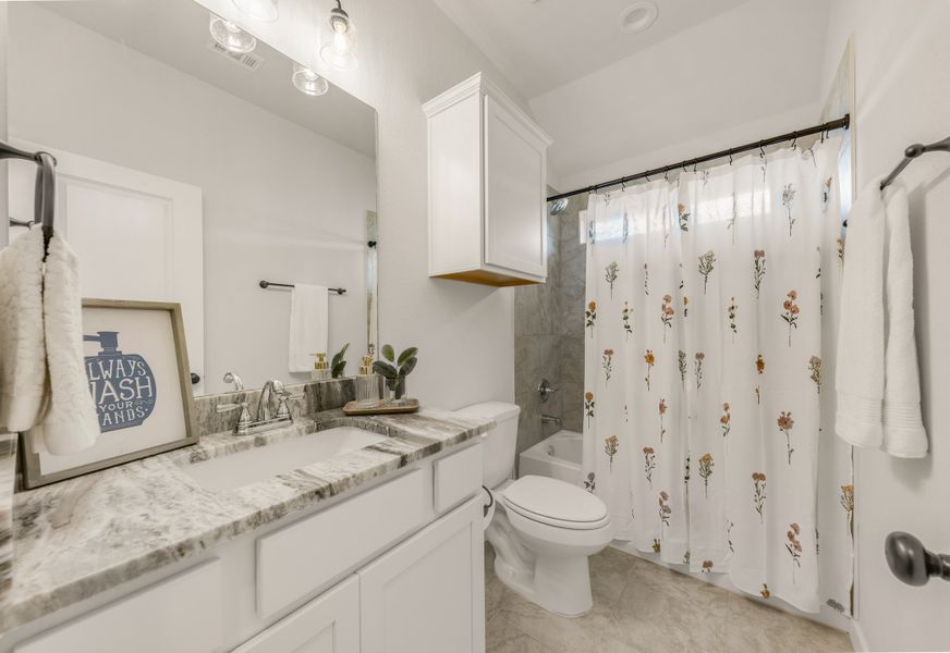 Representative furnished interior of a home built from the The Dahlia by Avonley Homes in Pinemont, Bryan (Image 18).