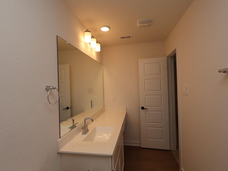 Furnished interior view inside a new home in Sorella, Tomball (Image 8).