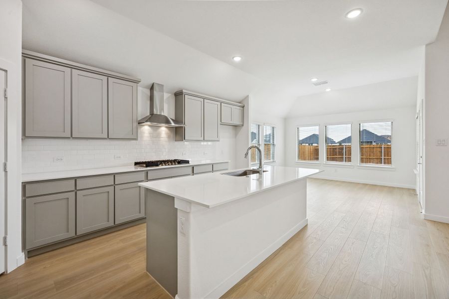 Kitchen in the Gilmour II home plan by Trophy Signature Homes – REPRESENTATIVE PHOTO (sterling)