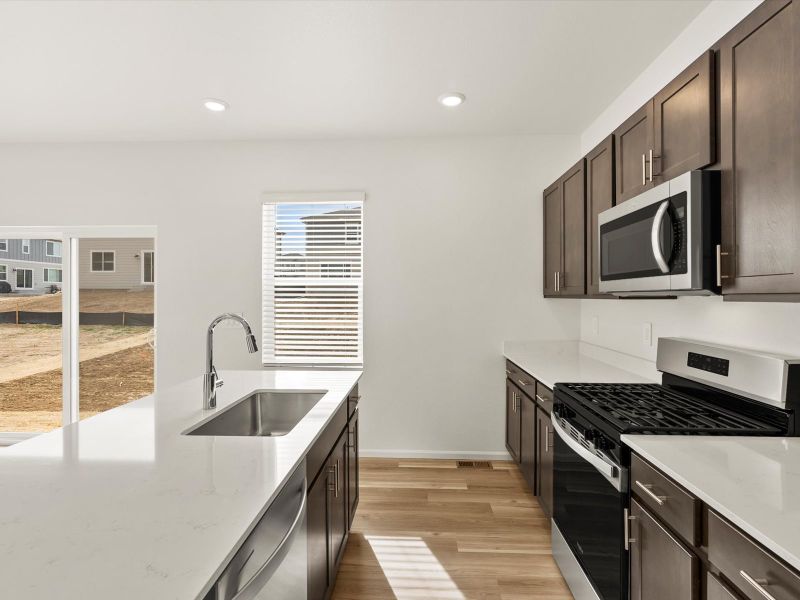 Furnished interior view inside a new home in Frontier Estates - The Trails Collection, Firestone (Image 3).