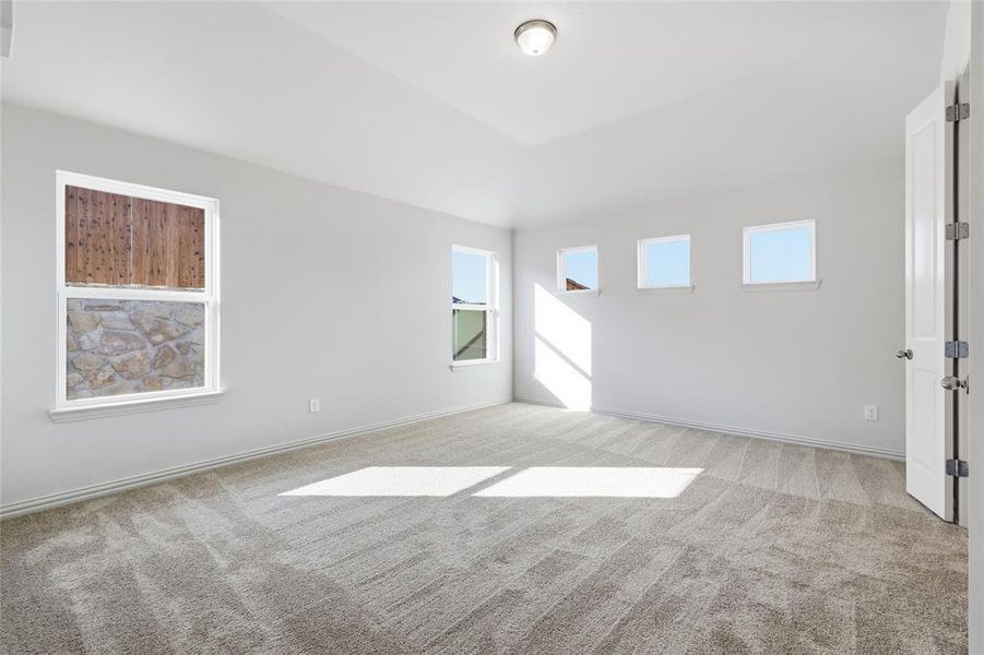 Spare room with light carpet Spare room with light carpet