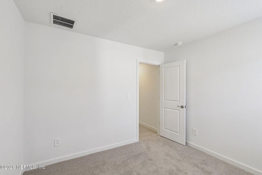 Spacious, unfurnished interior of a new home in Colbert Landings, Palm Coast (Image 27).