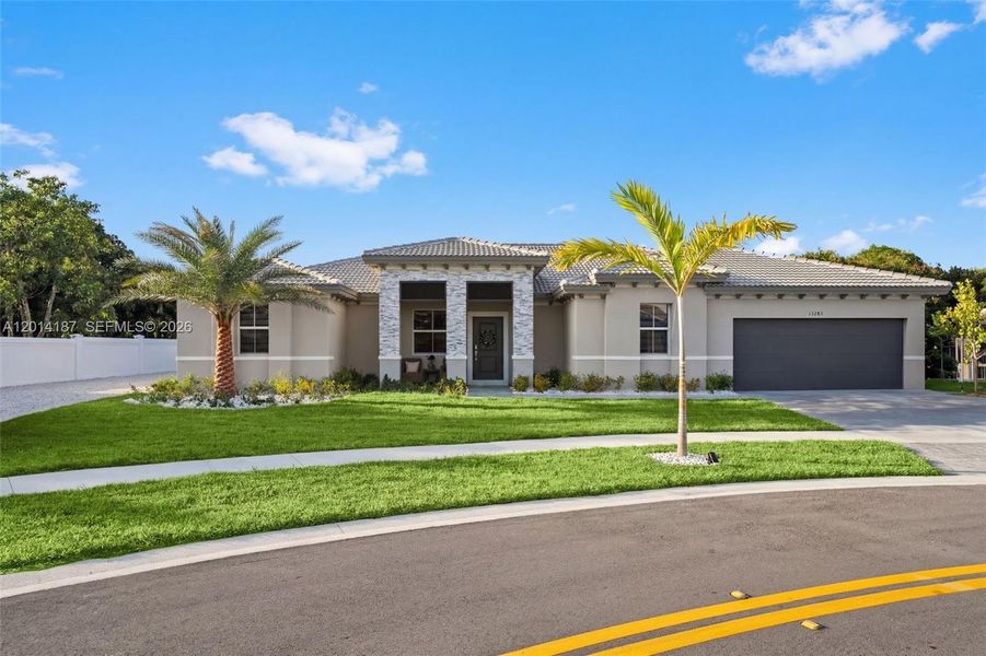 Front exterior of a new home in Hawthorne at Galiano Pointe, Miami, FL, highlighting curb appeal (Image 1). Front exterior of a new home in Hawthorne at Galiano Pointe, Miami, FL, highlighting curb appeal (Image 1).