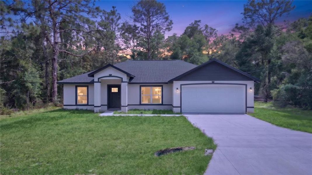 Front exterior of a new home in , Ocklawaha, FL, highlighting curb appeal (Image 25).