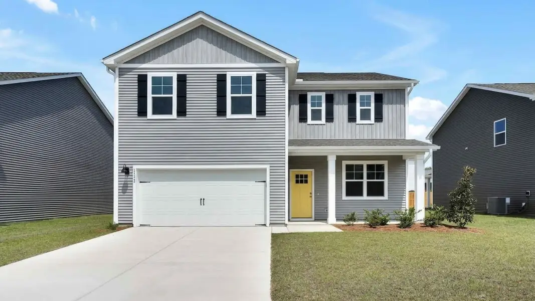 Front exterior of a new home in Bella Point, Bolivia, NC, highlighting curb appeal (Image 1). Front exterior of a new home in Bella Point, Bolivia, NC, highlighting curb appeal (Image 1).