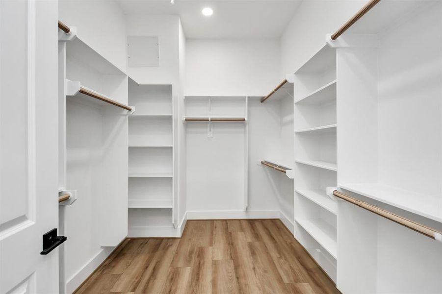 Walk-in closet in primary bedroom