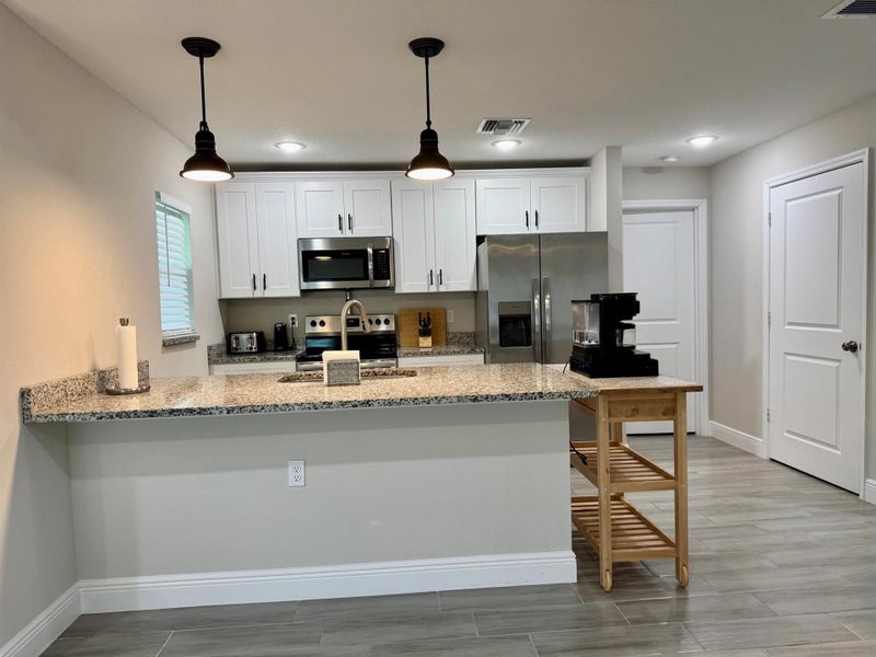 Furnished interior view inside a new home in , Okeechobee (Image 3).