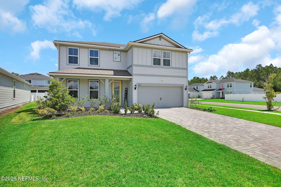 Front exterior of a new home in Double Branch, Middleburg, FL, highlighting curb appeal (Image 29). Front exterior of a new home in Double Branch, Middleburg, FL, highlighting curb appeal (Image 29).