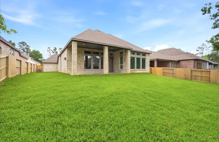 Exterior details and patio area of a home in The Woodlands Hills 65′, Willis (Image 3). Exterior details and patio area of a home in The Woodlands Hills 65′, Willis (Image 3).