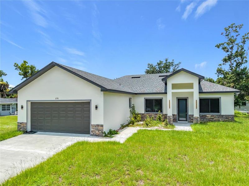 Front exterior of a new home in , Port Charlotte, FL, highlighting curb appeal (Image 28). Front exterior of a new home in , Port Charlotte, FL, highlighting curb appeal (Image 28).