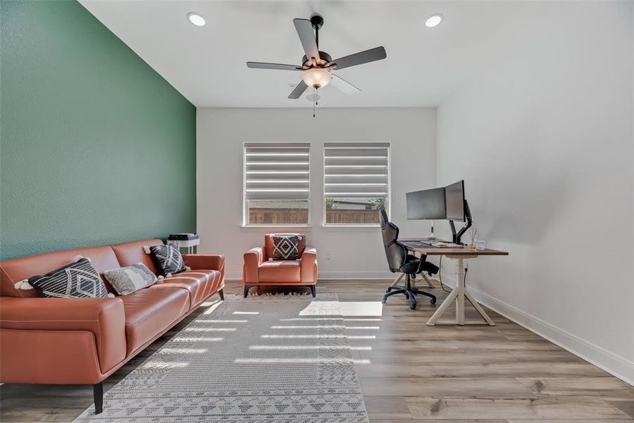 Office space with light wood-type flooring, recessed lighting, and ceiling fan