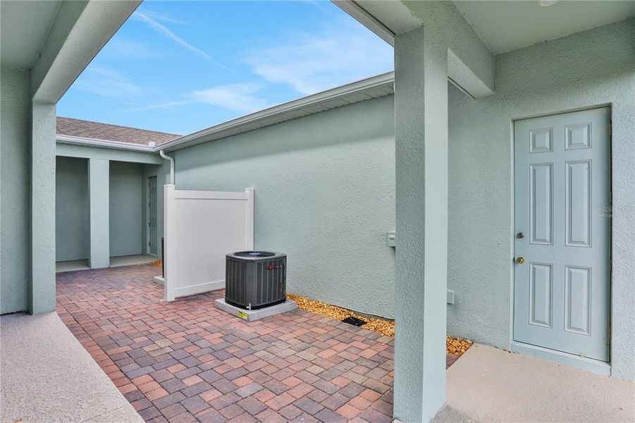 Exterior details and patio area of a home in Serenade at Ovation, Winter Garden (Image 24).