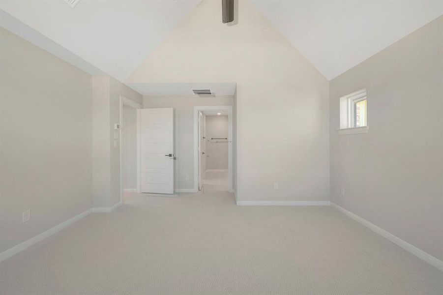 Unfurnished bedroom with carpet flooring and a ceiling fan