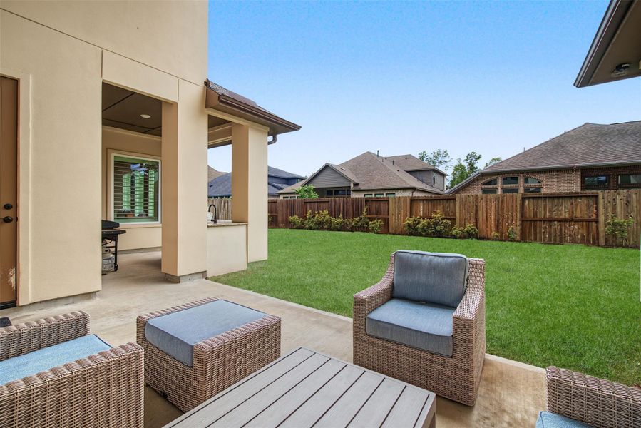 Exterior details and patio area of a home in The Highlands, Porter (Image 24).