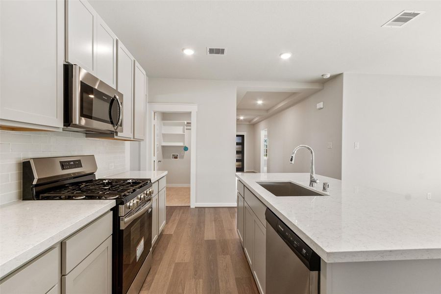 Furnished interior view inside a new home in Sunterra, Katy (Image 10).