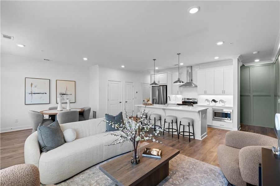 Main Level features 9 ft ceilings with an open concept layout. *Images shown are from a decorated model of the same floor plan. Design selections and color packages will vary by home.* Main Level features 9 ft ceilings with an open concept layout. *Images shown are from a decorated model of the same floor plan. Design selections and color packages will vary by home.*