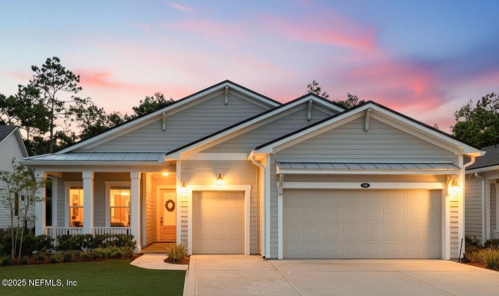 Front exterior of a new home in RiverTown - WaterSong, St. Johns, FL, highlighting curb appeal (Image 26).