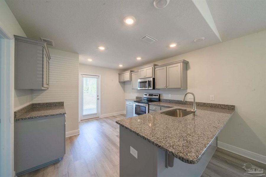 Furnished interior view inside a new home in Turtle Creek, Cantonment (Image 5).