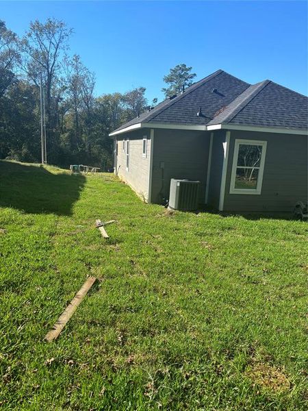 Exterior details and patio area of a home in Frontier Lakes, Willis (Image 19). Exterior details and patio area of a home in Frontier Lakes, Willis (Image 19).