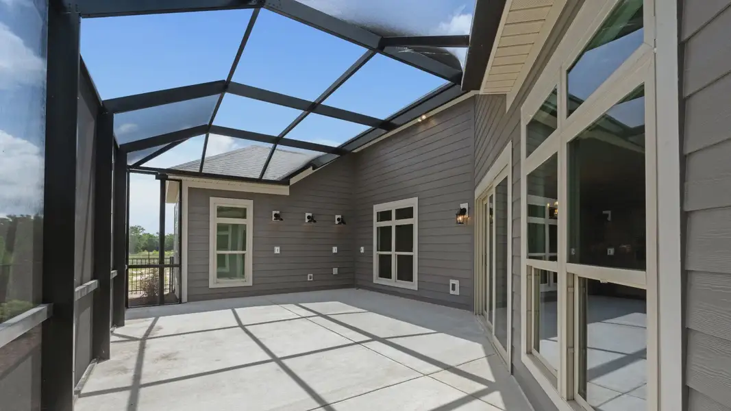 Exterior details and patio area of a home in Courtyards by Carrell, Ocean Isle Beach (Image 3). Exterior details and patio area of a home in Courtyards by Carrell, Ocean Isle Beach (Image 3).