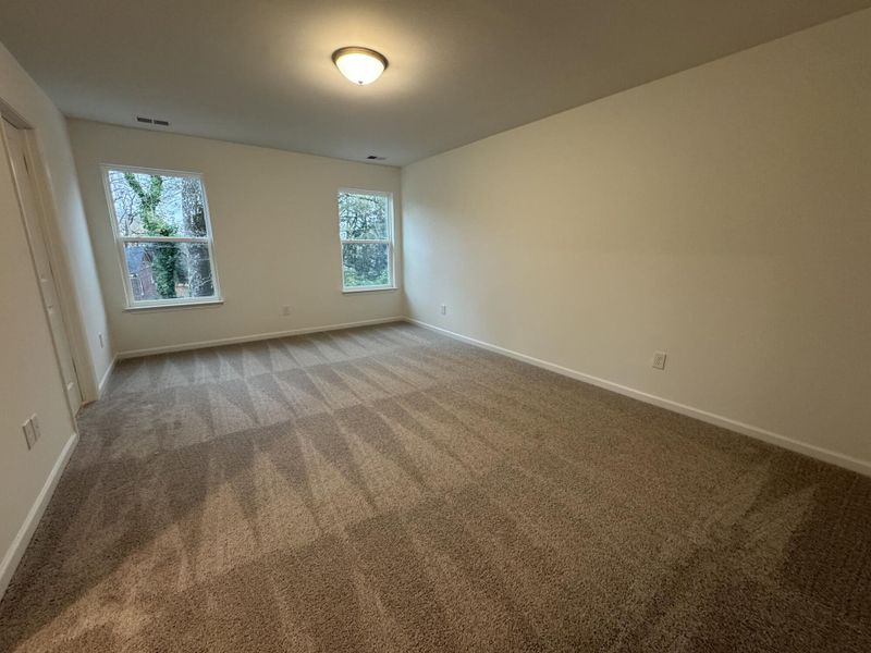Spacious, unfurnished interior of a new home in East Main Townes, Spartanburg (Image 16).