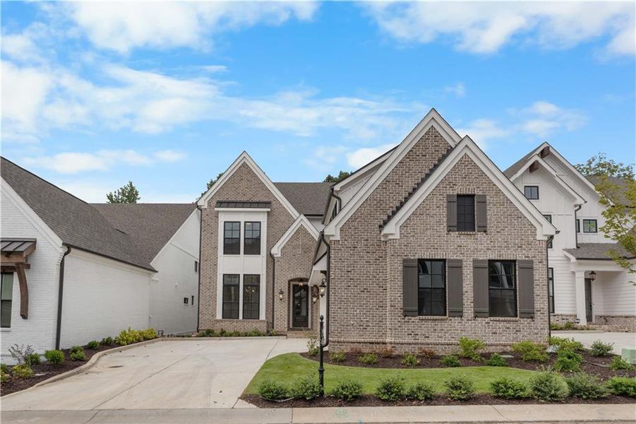 Front exterior of a new home in Waterside Single Family, Peachtree Corners, GA, highlighting curb appeal (Image 1). Front exterior of a new home in Waterside Single Family, Peachtree Corners, GA, highlighting curb appeal (Image 1).