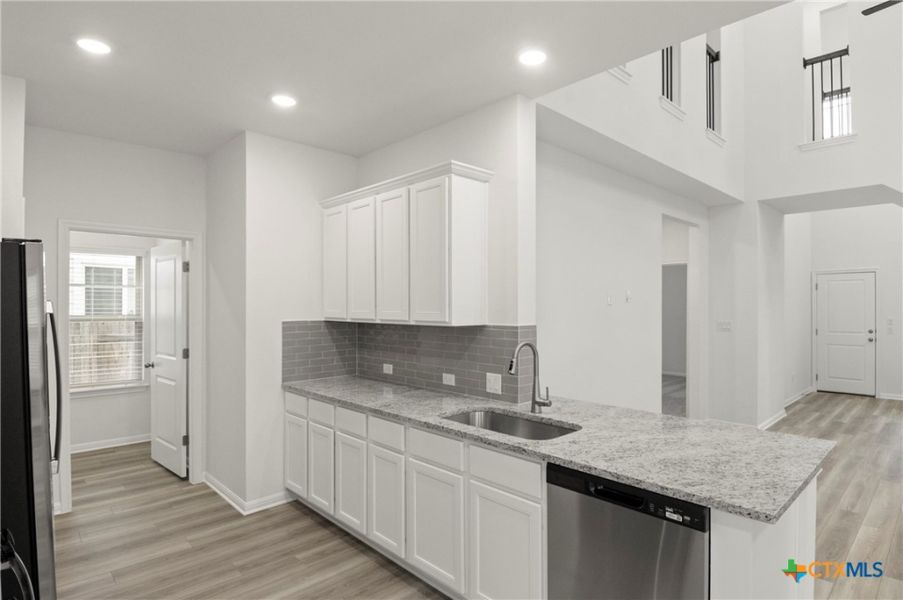 Furnished interior view inside a new home in Crosswinds, Kyle (Image 13).