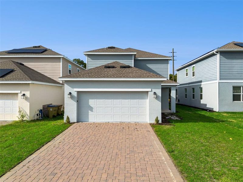 Front exterior of a new home in , St. Cloud, FL, highlighting curb appeal (Image 16). Front exterior of a new home in , St. Cloud, FL, highlighting curb appeal (Image 16).