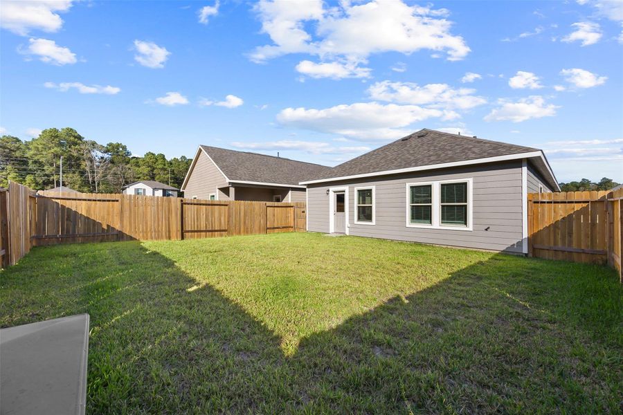 Exterior details and patio area of a home in Enclave at Dobbin, Magnolia (Image 3).