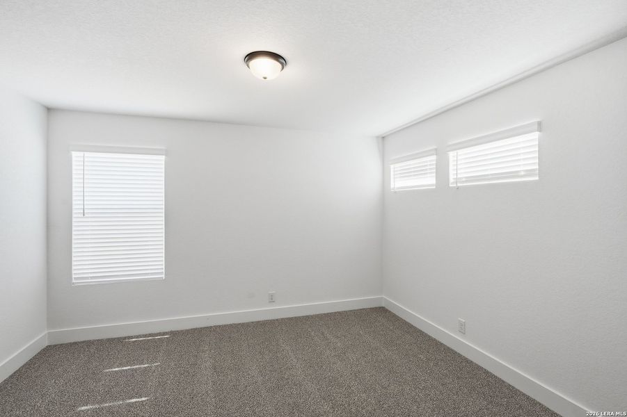 Spacious, unfurnished interior of a new home in Prominence, San Antonio (Image 34).