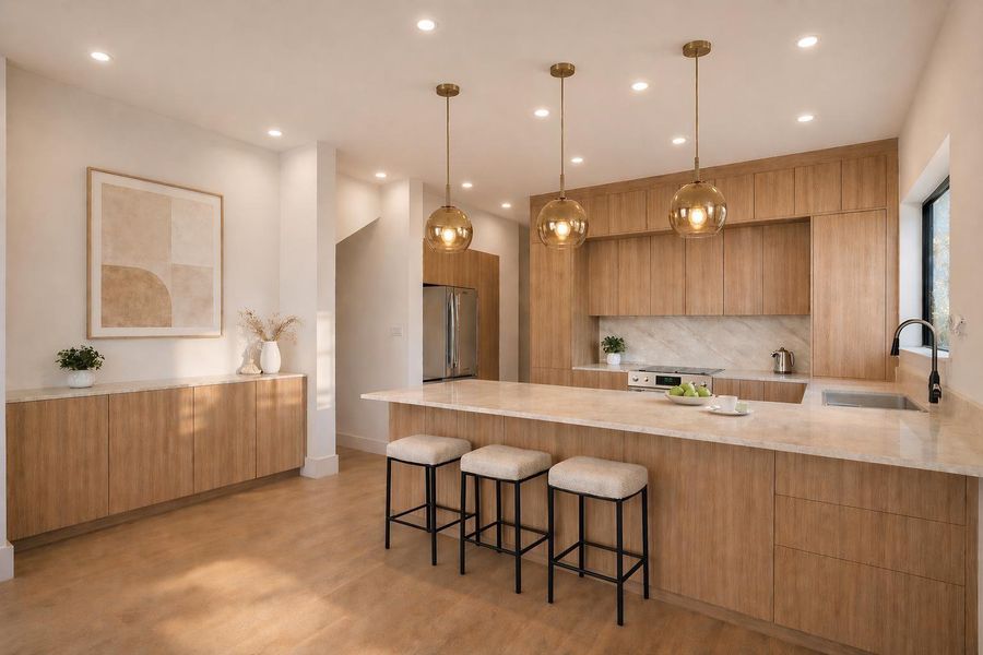 Bright and functional kitchen featuring a quartz island, abundant cabinet storage, and plenty of natural light, designed for both everyday living and effortless entertaining.