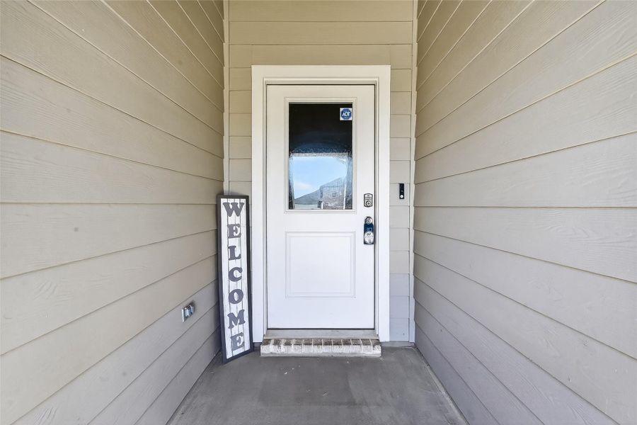 Charming porch creating a warm first impression and added curb appeal