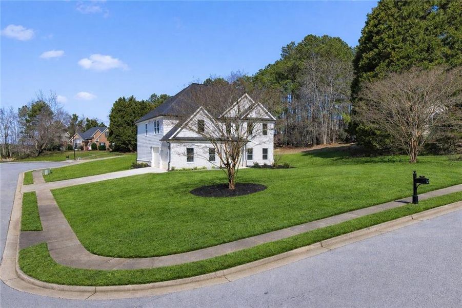 Front exterior of a new home in , Stockbridge, GA, highlighting curb appeal (Image 31). Front exterior of a new home in , Stockbridge, GA, highlighting curb appeal (Image 31).