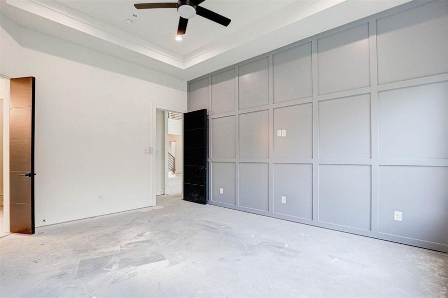 Primary bedroom featuring ceiling fan