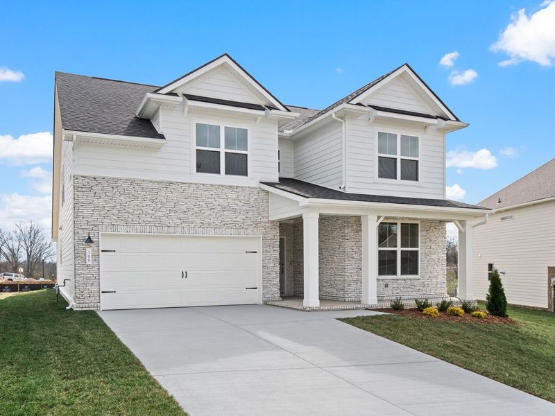 Front exterior of a new home in Woods Crossing, Gallatin, TN, highlighting curb appeal (Image 28).