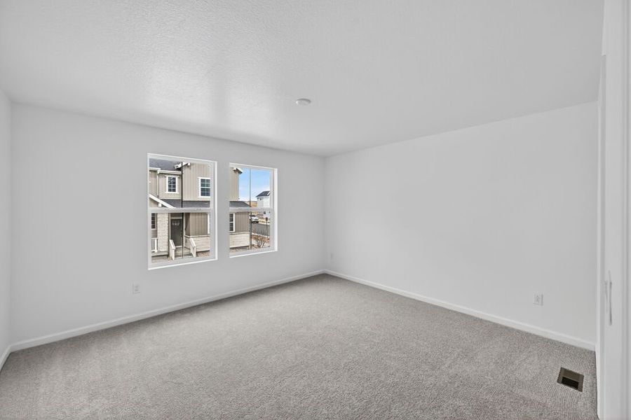 Spacious, unfurnished interior of a new home in Trailstone, Arvada (Image 11).