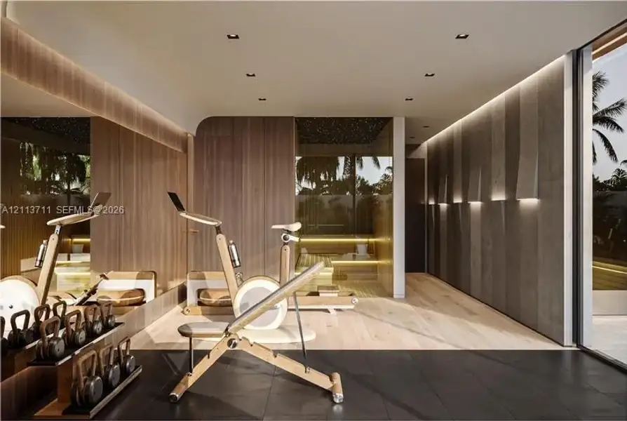 Wood-finish wall paneling, integrated recessed ceiling lighting, large-format matte floor tiling, full-height mirror wall, and glass-enclosed sauna with tiered bench seating