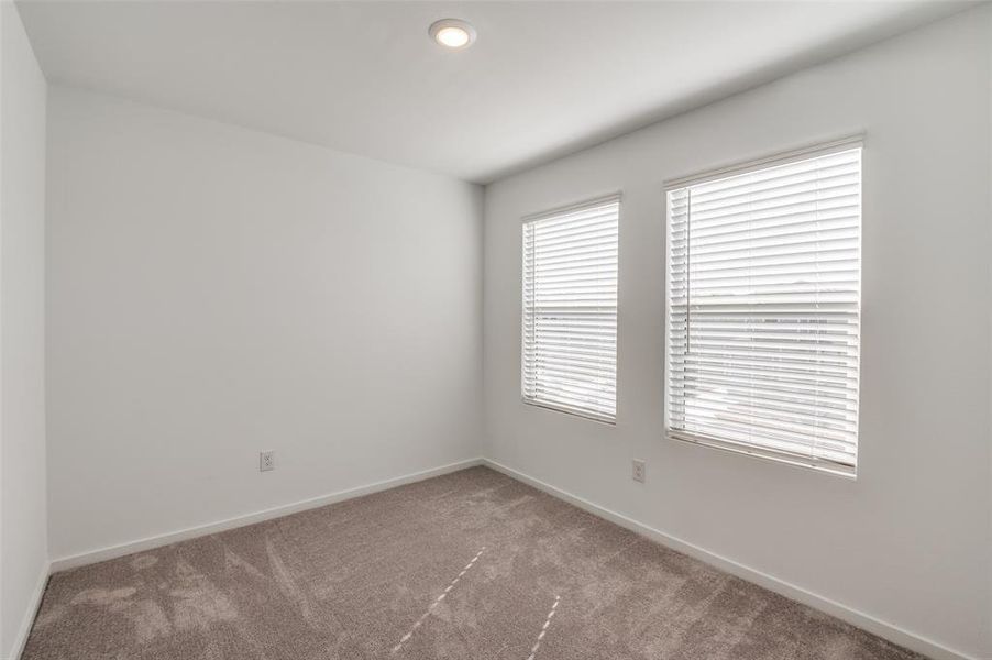 Unfurnished room with carpet floors
