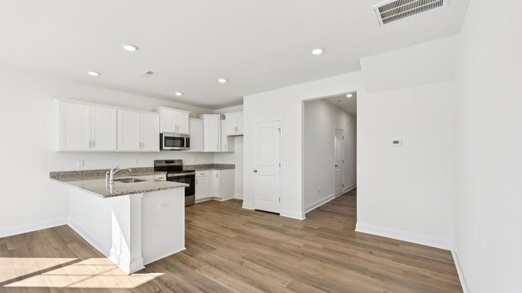 Furnished interior view inside a new home in Battle Bridge, Raleigh (Image 7).