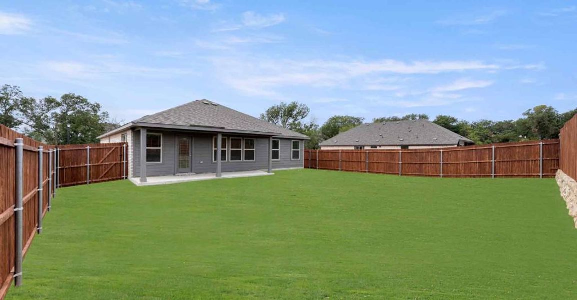 Representative exterior photo of a completed home built from the Atlanta by Impression Homes in Keeneland, Aubrey, TX (Image 24).