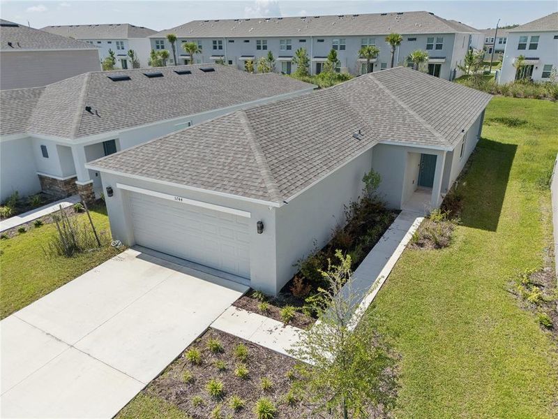 Front exterior of a new home in Westview Community Group Page, Kissimmee, FL, highlighting curb appeal (Image 20).