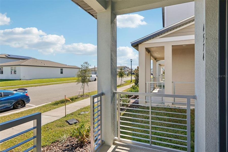 Exterior details and patio area of a home in The Meadow at Crossprairie Bungalows, St. Cloud (Image 4).