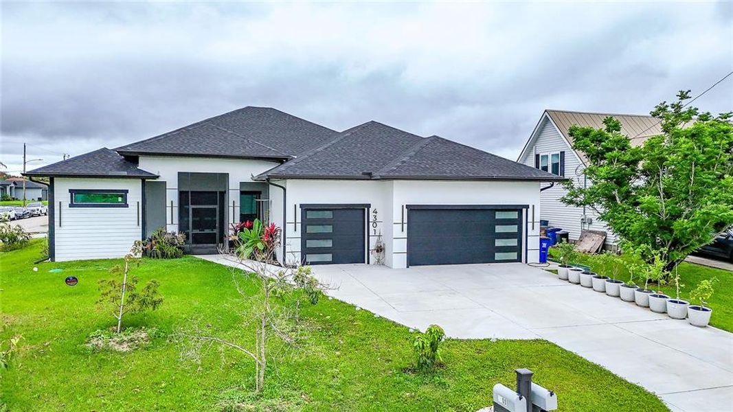 Front exterior of a new home in , Lehigh Acres, FL, highlighting curb appeal (Image 29).