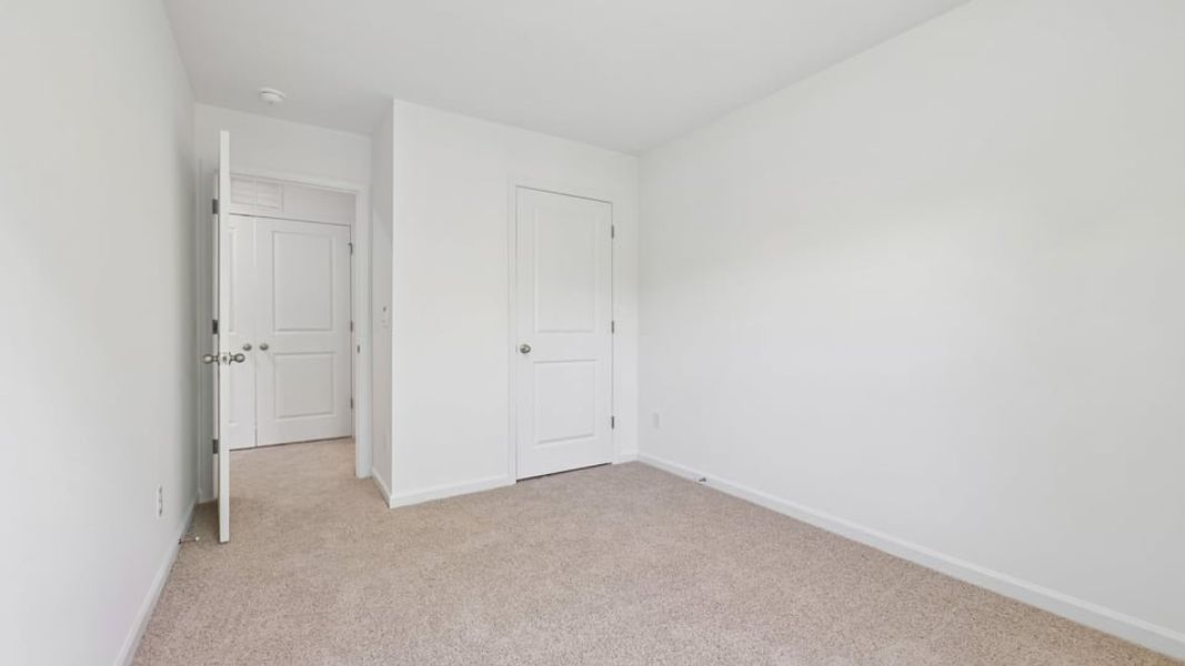 Spacious, unfurnished interior of a new home in The Townes at Belle Grove, Wendell (Image 15).